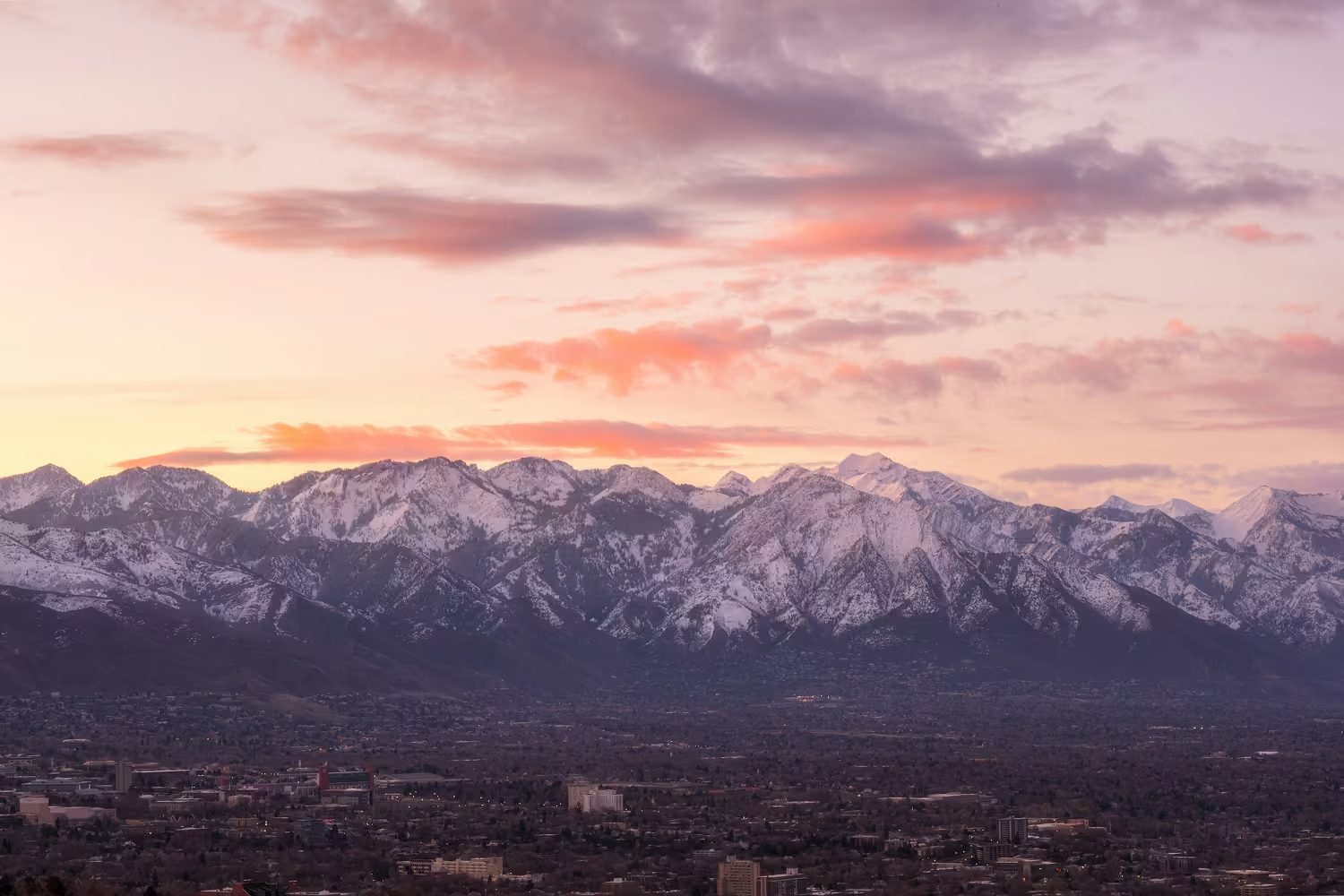 Alpenglow over the snow-covered Wasatch Range above the Salt Lake Valley at dusk